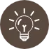 茶色の背景に描かれた電球アイコンの画像です。